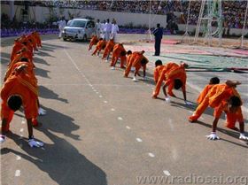 46. Swami's car being welcomed in an unusual way by the Primary School boys when He arrives for the 